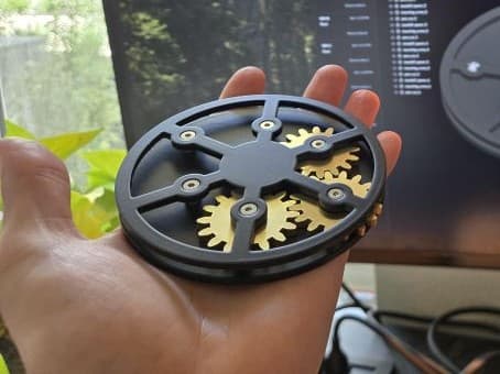 Finished gearbox coaster held in hand